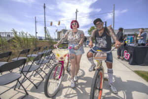 Nikki Neuzil owner of Flamingo Vintage in Southwest Detroit and Finn Formica take the bike path for a spin