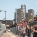 Grand stand fans watching the Detroit Grand Prix with the Renaissance Center in the background