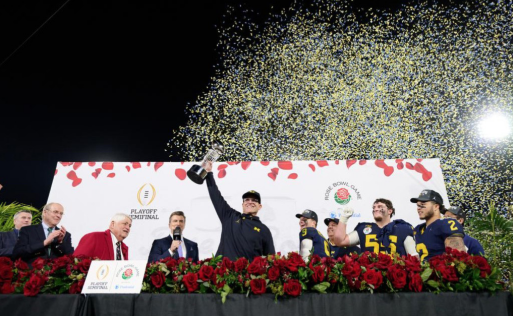 Photo is head coach Jim Harbaugh raising the Rose Bowl trophy after defeating the Crimson Tide. Photo provided by the University of Michigan Wolverines Athletics Department