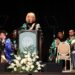 Dr. Espy gives her acceptance speech at her investiture ceremony as university and community leaders look on.