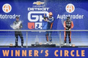 Winners circle, with 1st place winner Scott Dixon (C), 2nd place winner Marcus Ericsson (L), and 3rd place winner Marcus Armstrong (R) celebrating after race