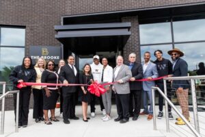 Funders, builders and government and community representatives join developer Clifford Brown and Detroit Mayor Mike Duggan at the ribbon cutting for The Brooke on Bagley. Photo credit City of Detroit