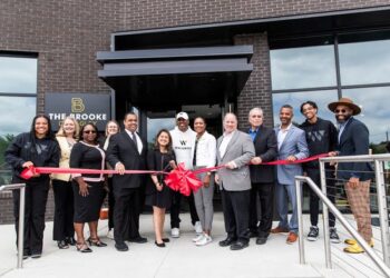 Funders, builders and government and community representatives join developer Clifford Brown and Detroit Mayor Mike Duggan at the ribbon cutting for The Brooke on Bagley. Photo credit City of Detroit