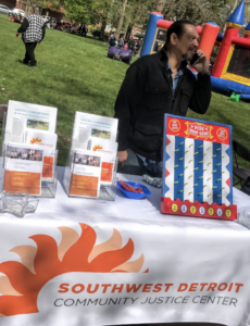 James Philips staffing an info table at Clark Park during Cinco de Mayo festival