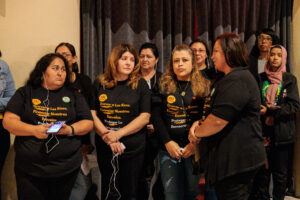 A group of community advocates listens to a panelist with the aid of translation during an event organized by 482 Forward at the Senate Theatre in Southwest Detroit Photo by Alejandro Ugalde Sandoval