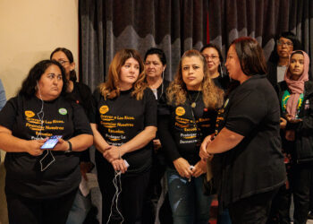 A group of community advocates listens to a panelist with the aid of translation during an event organized by 482 Forward at the Senate Theatre in Southwest Detroit Photo by Alejandro Ugalde Sandoval