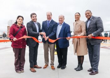 Ribbon cutting to celebrate the reopening of 16th St. at Fort St. Pictured, from left, Councilmember Gabriela Santiago-Romero, Sam Butler, Hubbard Richard Residents Association, Matt Moroun, Detroit International Bridge Company, Detroit Mayor Mike Duggan, Detroit Council President Mary Shefield and State Representative Tyrone Carter.