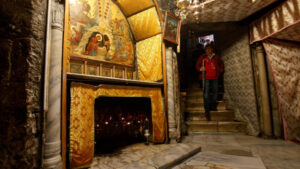 A visitor walks in the cave, where Virgin Mary is believed to have given birth to Jesus, inside the Church of the Nativity in the West Bank town of Bethlehem December 12, 2017. Picture taken December 12, 2017. REUTERS/Mussa Qawasma