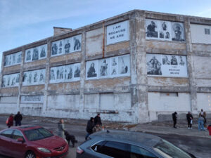 More than 100 portraits were installed on the vacant building at 1800 18th St. in