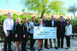 Archbishop-designate Weisenburger and members of the Catholic Foundation for the Diocese of Tucson present a grant to the Tucson Medical Center to help disadvantaged and marginalized people access routine medical care and social services. During his time as bishop of Tucson, Archbishop-designate Weisenburger worked with the Catholic Foundation to raise support for poor, rural parishes in the diocese, as well as nonprofits and ministries caring for the vulnerable