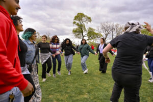Participants dance Dabke, a traditional Levantine folk dance, during the ‘Pieces of Detroit’ event at Roosevelt Park in Detroit, Michigan, on April 27, 2025. The celebration encouraged cultural exchange and community building between Corktown and Mexicantown residents.
