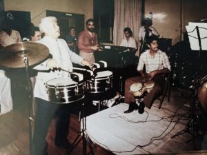 Tito Puente at 1984 Casa de Unidad appreciation dinner with Diego Melendez on bongos and Francisco Mora's Amigo band. Photo courtesy of Ozzie Rivera
