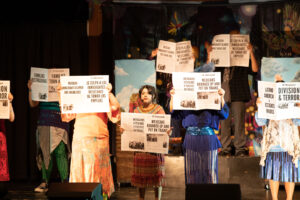 Actors hold up newspaper headlines about Herbert Hoover’s Repatriation of Mexicans in the 1930s