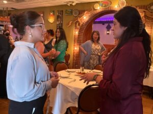 Juana Saavedra, business development manager at Alliance Catholic Credit Union, at left, met with former ACCU employee Brenda Villarruel to share their journeys as businesswomen and discuss their future goals