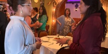 Juana Saavedra, business development manager at Alliance Catholic Credit Union, at left, met with former ACCU employee Brenda Villarruel to share their journeys as businesswomen and discuss their future goals