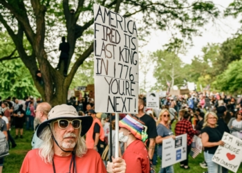 DETROIT, MI - JUNE 14, 2025: Approximately 4,000 Metro Detroit activists hold a No Kings Day rally at Clark Park in Detroit, Michigan on June 14, 2025 before marching through the streets of Southwest Detroit, home to the largest Hispanic population in the city, to show support for the immigrant community, denounce the rise of authoritarianism and the ongoing ICE raids, and to show solidarity with Los Angeles after President Trump deployed the National Guard and U.S. Marines to L.A. in response to large scale protests.