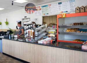 Focused and efficient, longtime employee Linda Sue Hoskins readies the counter for the next rush.