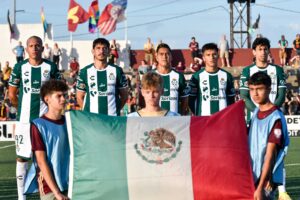 Club Santos Laguna players stand for the playing of the Mexican national anthem.