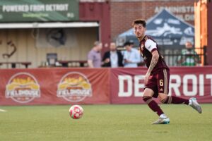Jay Chapman (#6) looks to make a pass
