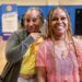 Kim Partee (left) with the Michigan Department of State celebrates with Alicia Kelley of Pontiac (right). Kelley left the Southwest Detroit clinic with her driver’s license fully reinstated. Photo provided Michigan Secretary of State