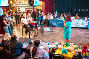 Bridget Espinosa presenting to the guests attending the Lazos Detroit event at El Salpicon