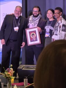 Joryán Hernandez, shown with Bishop John Stowe, Jessica Sun, and Charlene Howard (Executive Director of Pax Christi USA)
