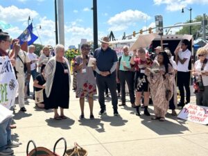 Pax Chrisi conference attendees held a prayer ceremony in front of the Spirit of Detroit