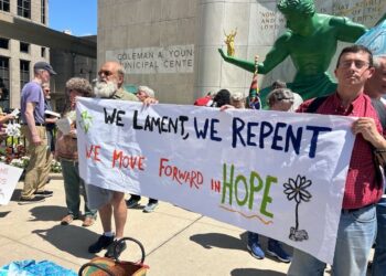 Pax Cristi in front of the Spirit of Detroit