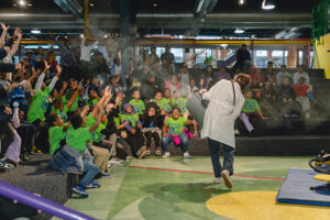 Fourth-grade students from Stevenson Elementary School engaging in a live, interactive science show on the science stage at the Michigan Science Center