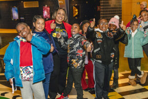 United Way for Southeastern Michigan’s president and CEO, Dr. Darienne Hudson, with a group of fourth grade students from one of United Way for Southeastern Michigan’s community schools.