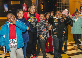 United Way for Southeastern Michigan’s president and CEO, Dr. Darienne Hudson, with a group of fourth grade students from one of United Way for Southeastern Michigan’s community schools.