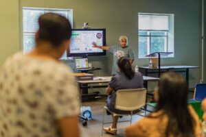 Gema Lowe, a Cosecha member, provides information about immigration rights and ICE encounters.