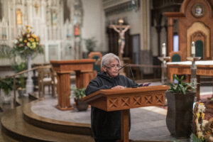 Gema Lowe, a Cosecha movement member, speaks defending immigrants' rights during the Mass for the Immigrants in Grand Rapids on November 24th.
