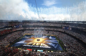 Aerial view of a packed stadium during a closing ceremony, with fireworks filling the sky and a large field display reading "FIFA World Cup 2026, The Final."